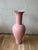 A striking large-scale ceramic floor vase by Jaru of California, executed in a soft blush pink crackle glaze. The...