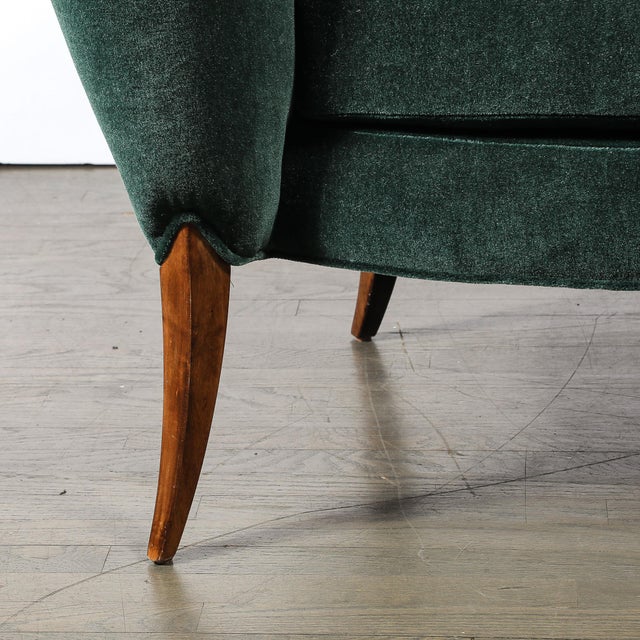 A captivating Art Deco lounge chair, this piece features a striking scroll form silhouette paired with elegantly stylized...