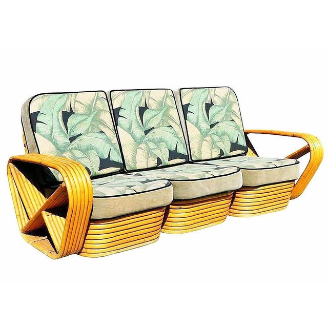 This beautifully restored Paul Frankl-style mid-century tropical seating set features natural golden-toned rattan frames...