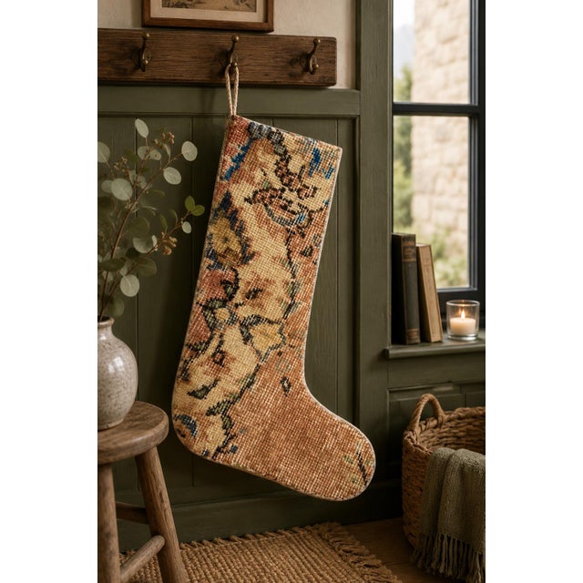 Hand-cut from a genuine vintage Turkish wool kilim, this stocking showcases a warm camel and rust ground with a delicate...