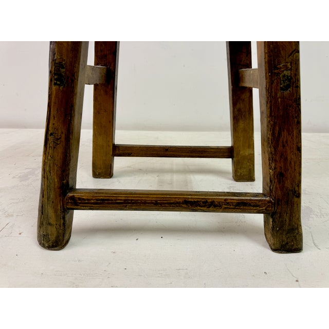 Rustic stool Elm Visible joints Great patina This is a rustic wooden stool with a traditional handcrafted design,...