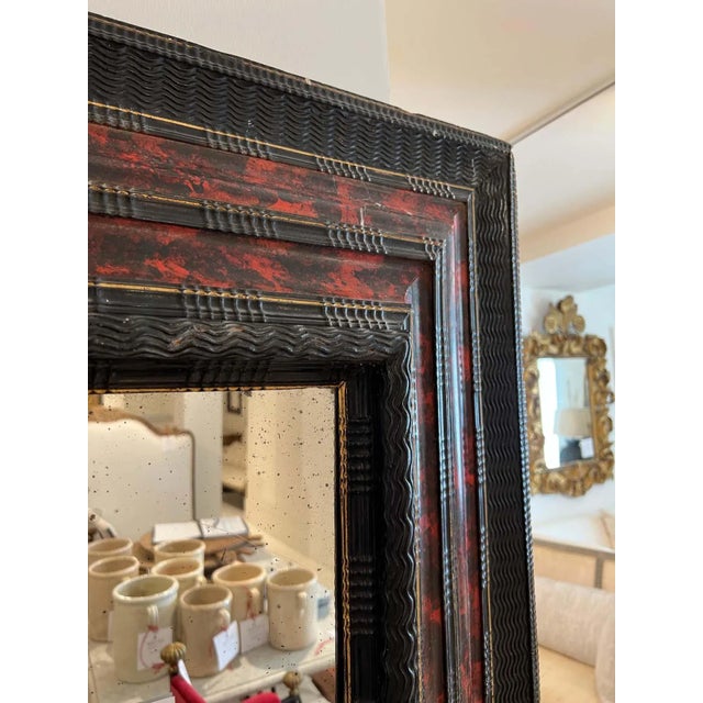 A very wide frame with painted "Faux" finish to resemble tortoise shell.