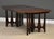 A mid century modern walnut dining table with one 18” leaves which fully expand the table to 80.25” by Broyhill Brasilia....