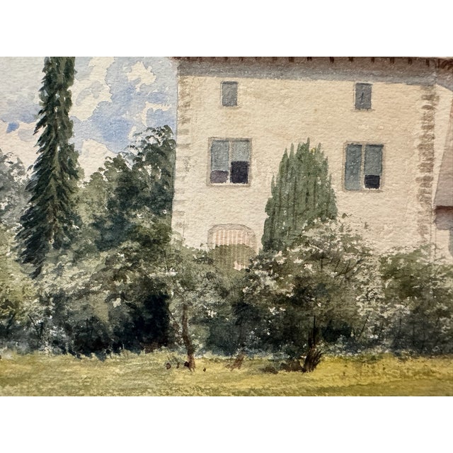 Original watercolor on textured paper depicting a substantial country house with pale walls, steep reddish-brown roofs,...