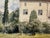 Original watercolor on textured paper depicting a substantial country house with pale walls, steep reddish-brown roofs,...