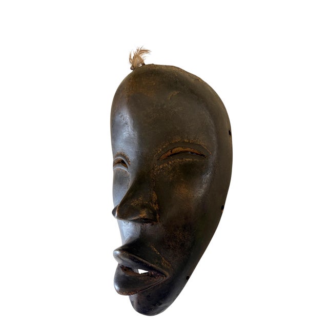 This exquisite Dan tribe African Art depicts a ceremonial dance mask. Originating from the Ivory Coast, it likely belonged...