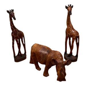 Group of 3 Mid 20th Century African Handcarved Hardwood Sculptures of Rhinoceros and a Pair of Giraffes
