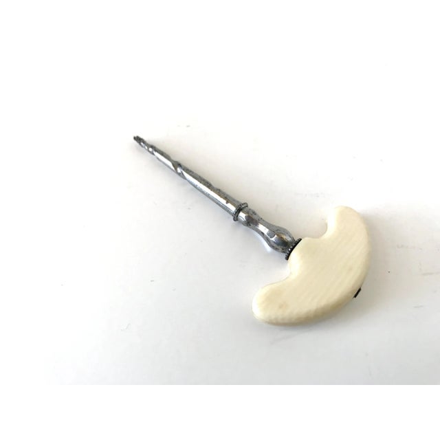 An antique 19th-century French small perfume corkscrew or chemist's corkscrew, for small bottles of scents and potions....