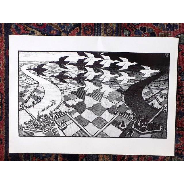 This vintage 20th century lithograph (offset) depicts one of M. C. Escher's (Netherlands 1898-1972) fascinating and iconic...