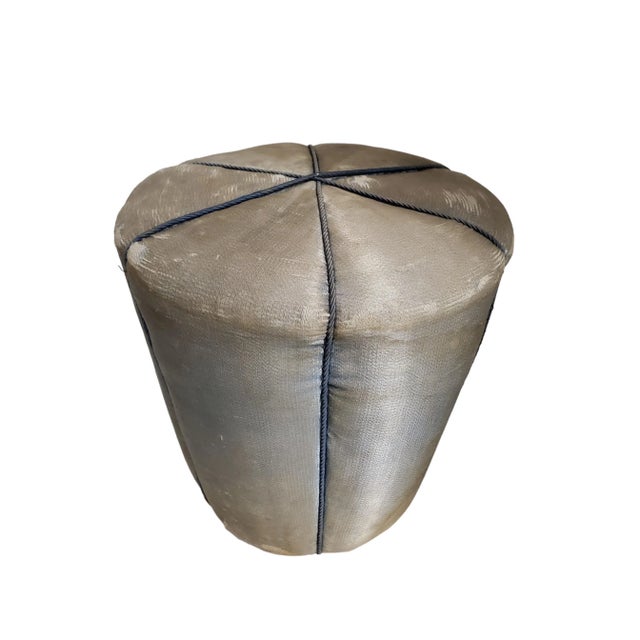 An original and captivating Art Deco silk upholstered pouf, attributed to Jindrich Halabala for UP Závody. This stool...