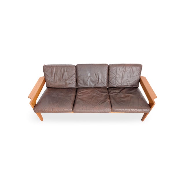 Vintage three-seater sofa from the renowned Danish manufacturer "Komfort" for sale. Designed by Arne Wahl Iversen, one of...