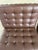 Authentic pair of KnollStudio Barcelona chairs designed by Ludwig Mies van der Rohe. Upholstered in brown leather with...