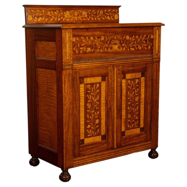A fine antique Dutch walnut two door cabinet with inlaid specimen wood parquetry and marquetry floral inlay, circa 1860....