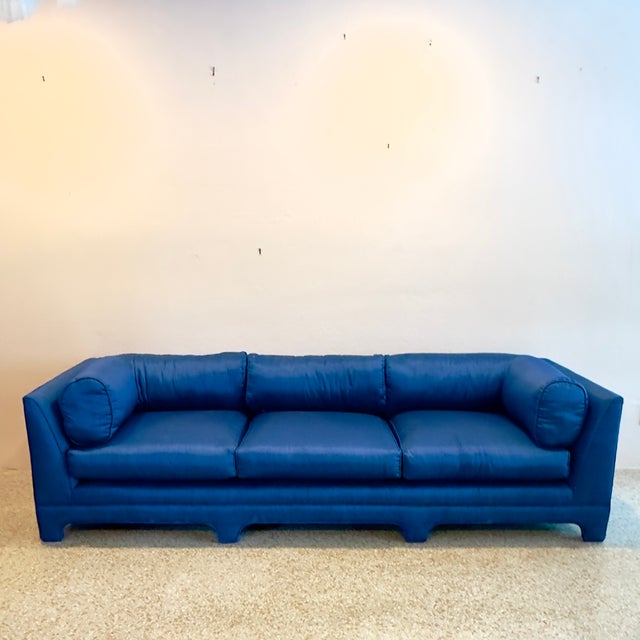 Elevate your living space with this exceptional vintage tuxedo-style sofa, blending late Mid-Century minimalism with bold...