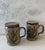 Pair of vintage stoneware salt and pepper shakers featuring a floral design. Made by Centerpoint circa 1970s.