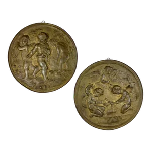 Pair of 19th Century Angels at Work Brass Repousse Decorative Rounds