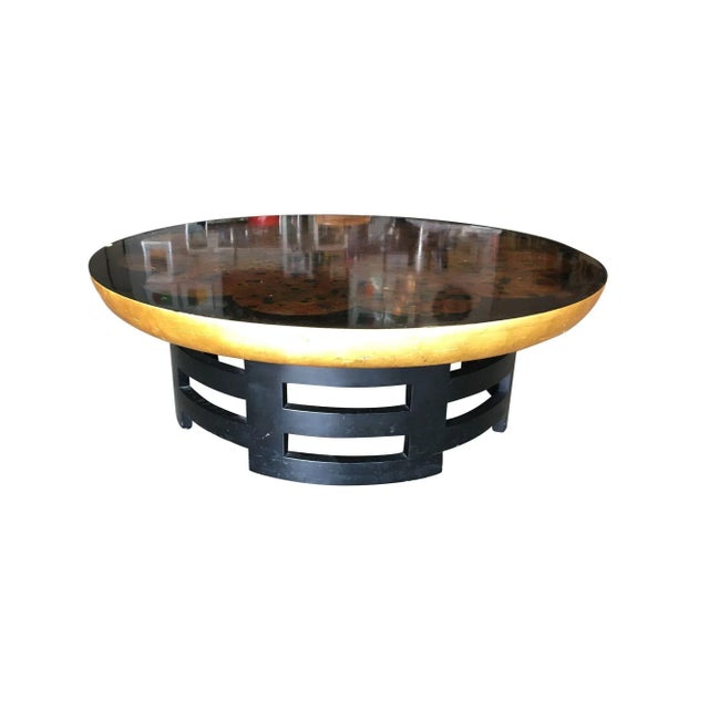 Asian inspired coffee table with black sculpted base and black lacquer top by Muller and Barringer for Kittinger in the...