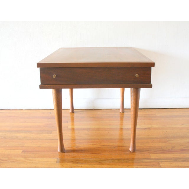 This is a mid century modern side end table nightstand by American of Martinsville. It has a beautiful wood grain on top,...