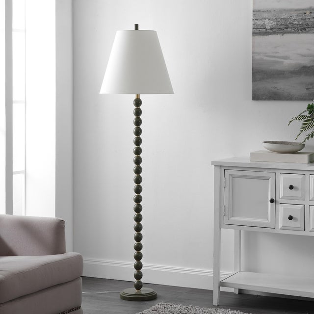Illuminate your space with the Callie Floor Lamp, a perfect blend of elegance and functionality. This green and gold lamp...