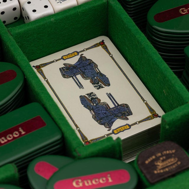 A rare 20th century travel poker set made by gucci. The travel case is crafted from dark pigskin leather and features...