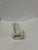 This is a mid 19th century vintage Staffordshire cat figurine. It is ceramic. It depicts a cat sitting. It is hand...
