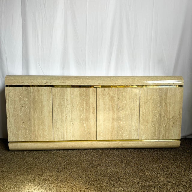Sleek and sophisticated, this Postmodern Faux Travertine Waterfall Credenza brings timeless elegance with a modern edge....