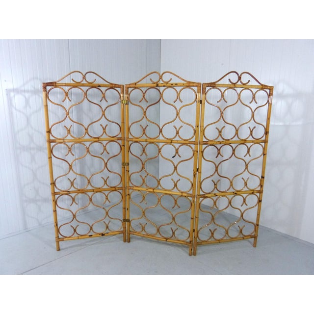 Elegant rattan folding screen / room divider. Nice shaped ratan screens connected with brass hinges. To use as room...