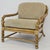 Vintage lounge chair created by the renowned McGuire Furniture Co. in San Francisco. c.1980's. This sculptural chair...