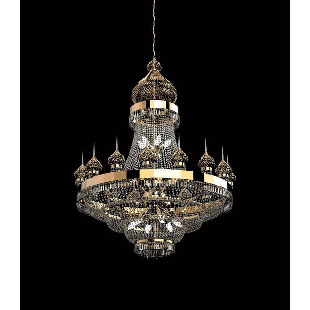 Doha 34 lights cascading chandelier in polished chrome and crystal by aggiolight. Dimensions: d 120 x h 160 cm. Materials:...