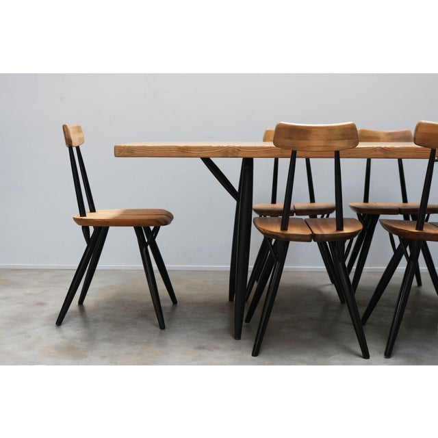 Experience the timeless elegance of mid-century modern design with the Pirkka dining room set by Ilmari Tapiovaara for...