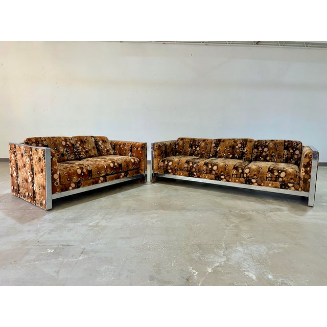 Mid Century Modern loveseat with chrome trim upholstered in Jack Lenor Larsen Primavera pattern cotton velvet in brown...
