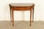 A gorgeous Federal or Hepplewhite style flip-top console or game table By Baker Furniture USA, Circa 1980s Mahogany, with...