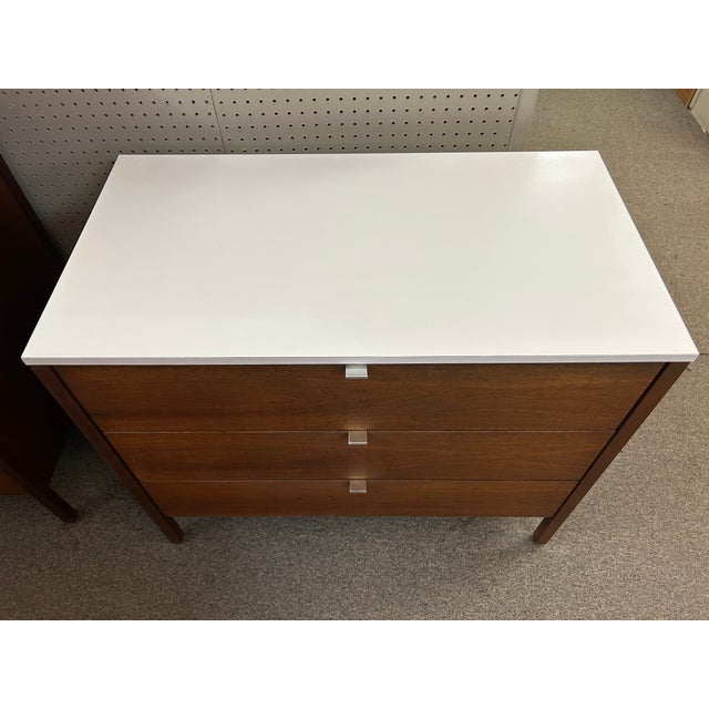You are viewing a fantastic 3 Drawer Walnut + White Laminate Chest by Florence Knoll c1960. The classic mid century design...