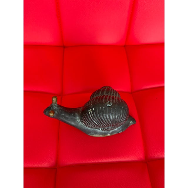 The Snail is well done. Nice casting Older piece makes for a great paper weight or add to your collection patina of brass...