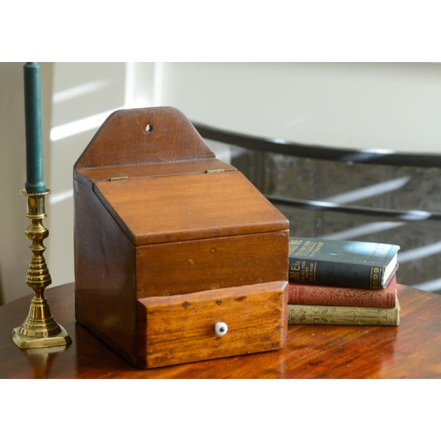 This is a vintage handmade wooden hanging candle, spice, or salt box. It measures 11.25" H x 8" D x 8.25" W. Features a...