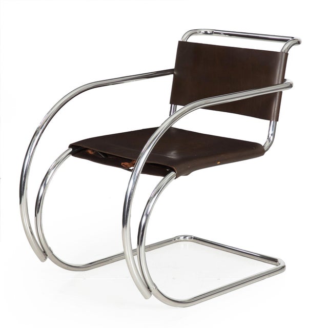 PAIR OF CHROME STEEL AND LEATHER MR20 ARMCHAIRS Designed by Mies van der Rohe, circa 1970s 31" H x 18 1/8" H to seat x 31...