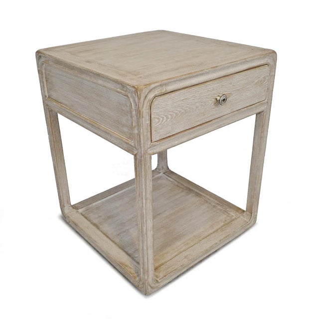 Salvaged washed elm wood bedside table with one drawer. Antiqued brass/white finish drawer knob. Each table will vary in...