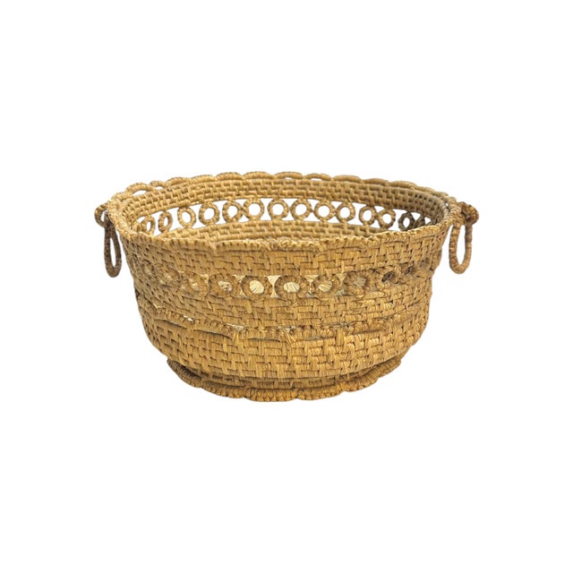 A charming antique French Provincial basket, beautifully handwoven using traditional coiled rope techniques. This petite...