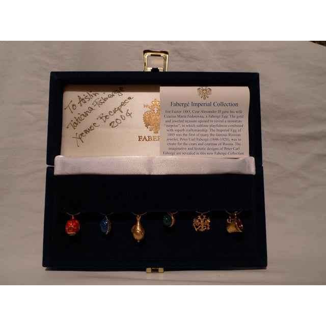 Offered is an assorted 6 piece set of Wine Charms (1/2 inch), individually colored Fabergé ornaments, 3 with an enamel...