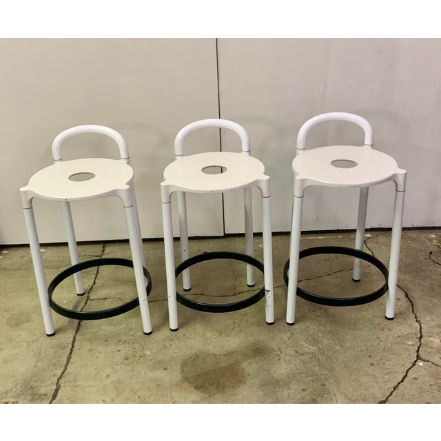 A set of three Italian-made stools produced by Kartell in the 1960s based on a design by Anna Castelli Ferrieri. Metal...