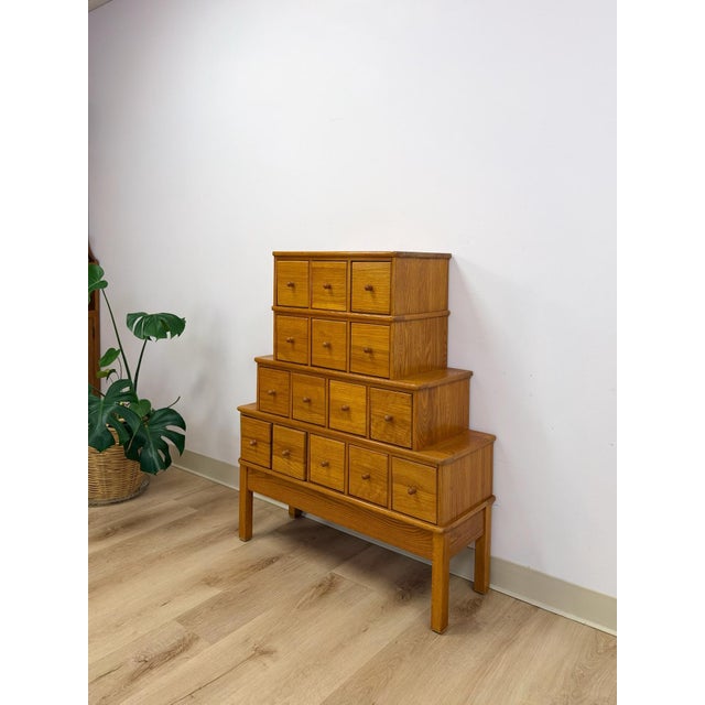 This wonderful handmade vintage tiered apothecary cabinet is a genuinely charming and highly functional artisan storage...