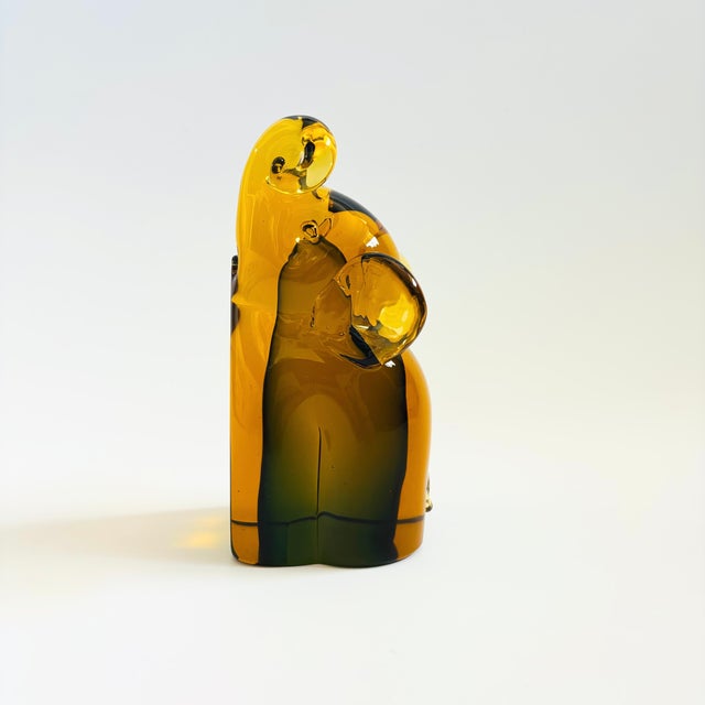 A mid century art glass bookend in the shape of an elephant. Beautiful sommerso ("submerged" in Italian) effect to the...