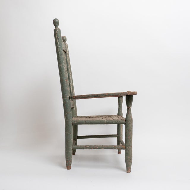 A charming hand-carved and hand-painted decorative armchair, crafted in the Curule-style form, inspired by classical...