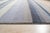 A hand-knotted wool rug, made in India and measuring 4' x 6'. Geometric drawing - repeating motifs held inside strong...
