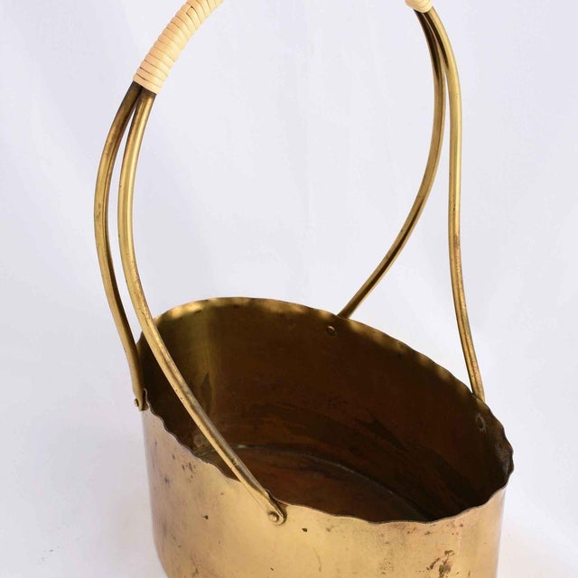 Handle bowl is an original decorative object realized in the 1960s. Original brass work. Created by Eugen Zint,...