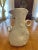 A striking modern organic ceramic sculptural vase/pitcher by Montes Doggett, handcrafted by skilled artisan potters in...