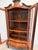 Elegant vitrine cabinet in louis xv style, crafted in richly figured wood with refined marquetry inlays throughout. The...