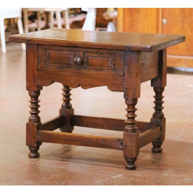 Richly patinated and full of authentic Old World character, this antique Spanish side table is distinguished by its...