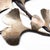 Ginkgo leaves a line on intricate, hand-crafted branches and seems to float through the air in our latest wall decor...