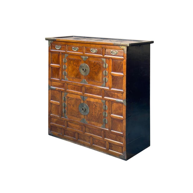 The Oriental Brown Brass Hardware Drawers Accent Storage Cabinet is a beautifully crafted piece that combines the richness...
